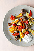Oven-roasted vegetables with meatballs