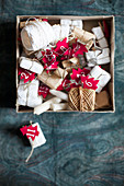 Box of gifts, twine and numbered, red felt Christmas trees