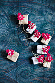 Small gifts with numbered, red felt Christmas trees