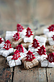 Small gifts with numbered, felt Christmas trees
