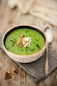 Curly kale soup with blue cheese and walnuts