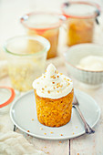 Vegan carrot cake, baked in mason jars, with soy cream topping