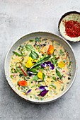 Colourful herb soup with saffron