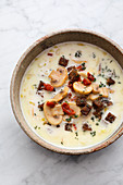 Cheese soup with herb croutons and mushrooms