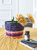 Storage basket made from knitted tubes made using knitting dolly