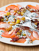 Salmon carpaccio with potatoes and pears