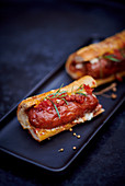 Hot dog with tomato coulis