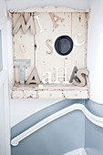 Decorative letters on shabby-chic shelf