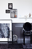 DIY-Bilder an weißer Wand mit dunkler Holzverkleidung