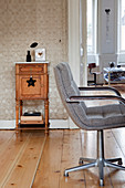 Retro swivel chair in front of an antique cabinet in an old building