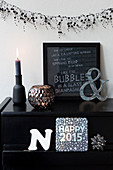 Winter decoration in black with pearl garland and typeface