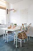 White-painted wooden table and chairs