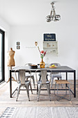 Industrial style dining room with metal chairs around rustic table