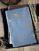 Embroidered tablecloth with a leaf motif