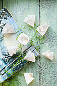 DIY fairy lights with little umbrellas made from paper doilies
