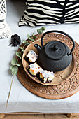 Marble cake on the tray next to an Asian teapot