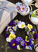 Flower wreath made of primroses, pansies and anemones as an Easter decoration