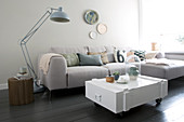 White wooden box as a coffee table in the living room in gray tones