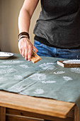 Stamping the fabric with a leaf motif