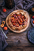 Rustic apricot galette on a wooden table