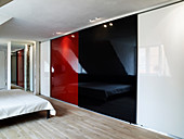 Floor-to-ceiling closet with sliding doors in a spacious bedroom