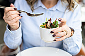 A woman eating salad