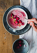 A smoothie bowl with raspberries