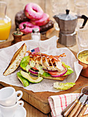 Chicken sandwich with avocado and American paper flags