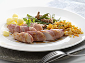 Rabbit fillets in bacon with a vegetable garnish