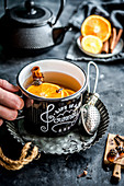 Mulled tea with oranges, cloves, cinnamon and Siberian cones