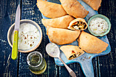 Mini calzone with lentils, spinach and feta