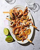 Grilled prawn skewers with limes