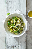Taglietelle with basil and rocket pesto, parmesan cheese and pine nuts