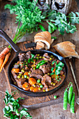 Beef stew with peas and carrots