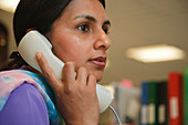 Woman on phone in office