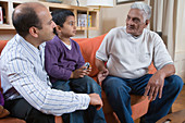 Family sitting on the sofa