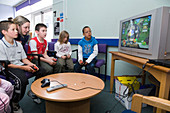 Children playing on a video game
