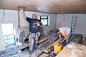 Men plastering the ceiling