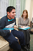 Social worker visiting disabled teenager at home