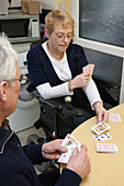 Husband and wife playing cards