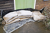 Sandbags in front of a door to reduce flooding