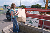 Woman recycling cardboard