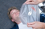 First Aid Officer using mouth to mouth face shield