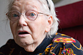 Woman with Alzheimer's disease looking concerned