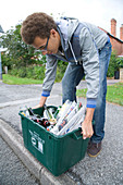 Placing curb side recycling collection box on the pavement
