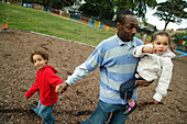 Man with children in playground