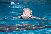Older woman swimming