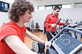 People using exercise bikes