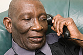 Older man chatting on the telephone