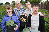 People with learning disabilities with produce on allotment